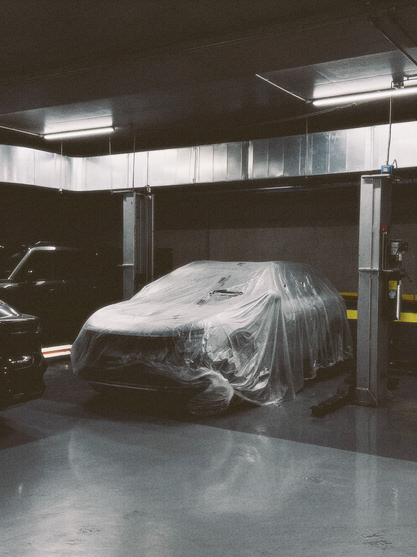 A vehicle on the lift inside the Monza SAL technical center