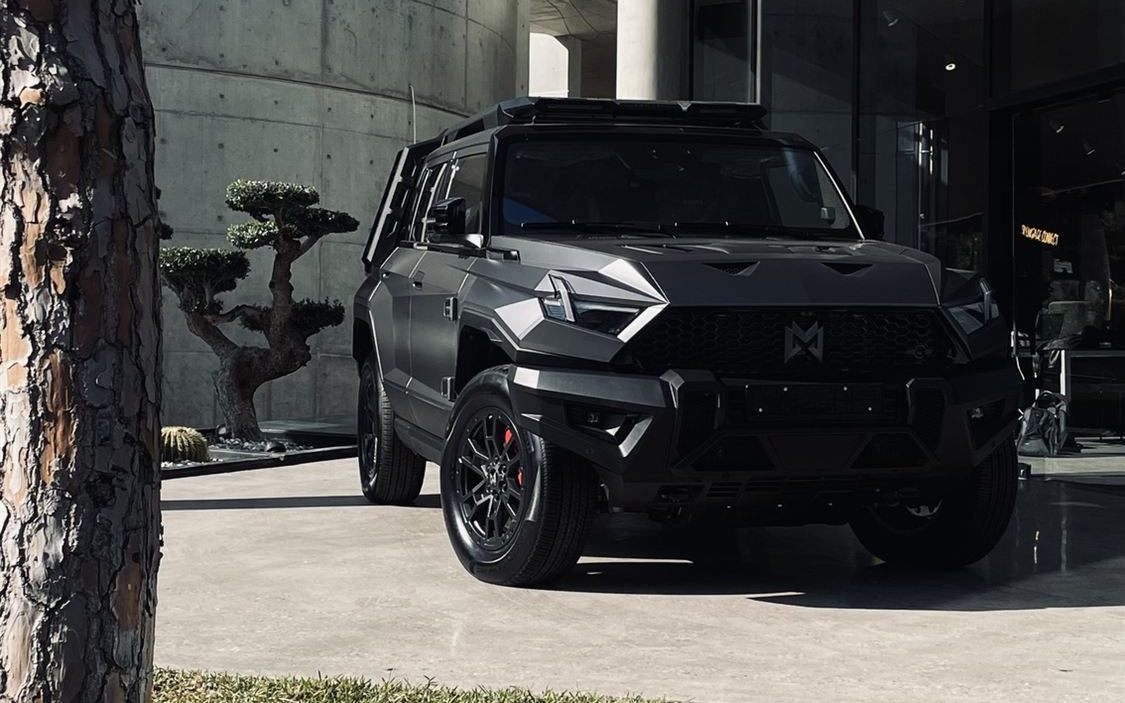MHERO 1 in matte black outside the Monza SAL showroom
